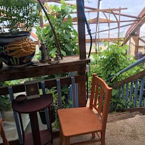 Lovely porch overlooking the greenhouse.