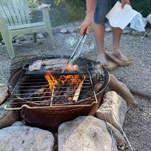 There was a fire pit with a grill there for us to use so didn’t have to bring our own grill. There was somewhere to buy wood less than 5 mins away. Bring cash!