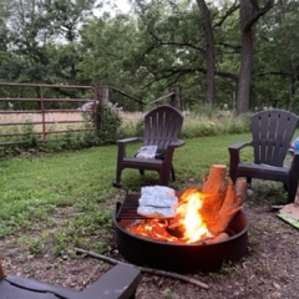 Camp chairs and fire pit at the walnuts site.