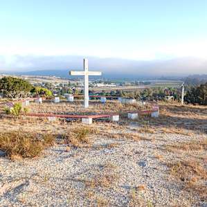 Illuminated cross on trail