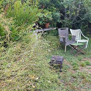 one of two sets of outdoor furniture, the other set has a couple of tables and a full size fold up table