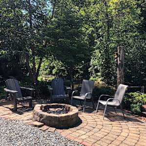 Fire pit with River in backyard