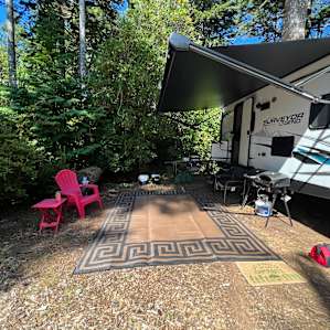 Another view of our campsite. You can see that we have a somewhat larger trailer, certainly not as big as I’m on the road, but it was perfect for Suzie’s campsite.
