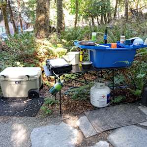 Kitchen setup with hot water for washing. Full set of dishes kept inside the yurt.
