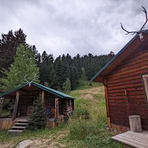 Cabin on bank of mountain stream