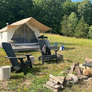 A beautiful set up with chairs, picnic table (not pictured), fire pit and the most incredible view.