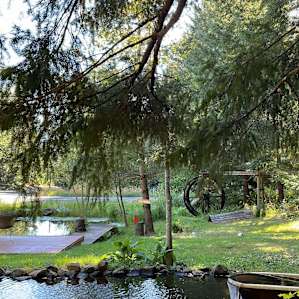 Photo of the deck and waterwheel next to the campsite. Also able to feed the fish for a quarter!
