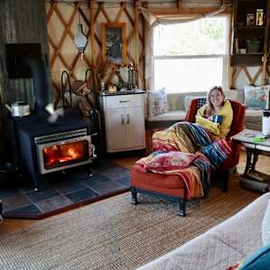 Cozying up fireside with morning coffee.