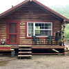 Rustic Riverside Camp - Log Cabin