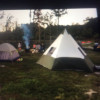 Shaded tent camping near bathhouse