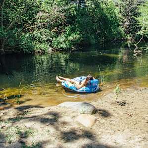Private cove with floaties and camping chairs to enjoy the river