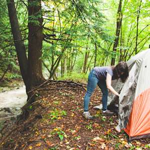 Setting up my tent creekside!