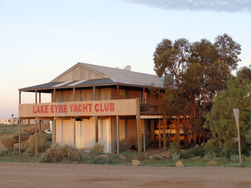 what does the lake eyre yacht club slogan mean
