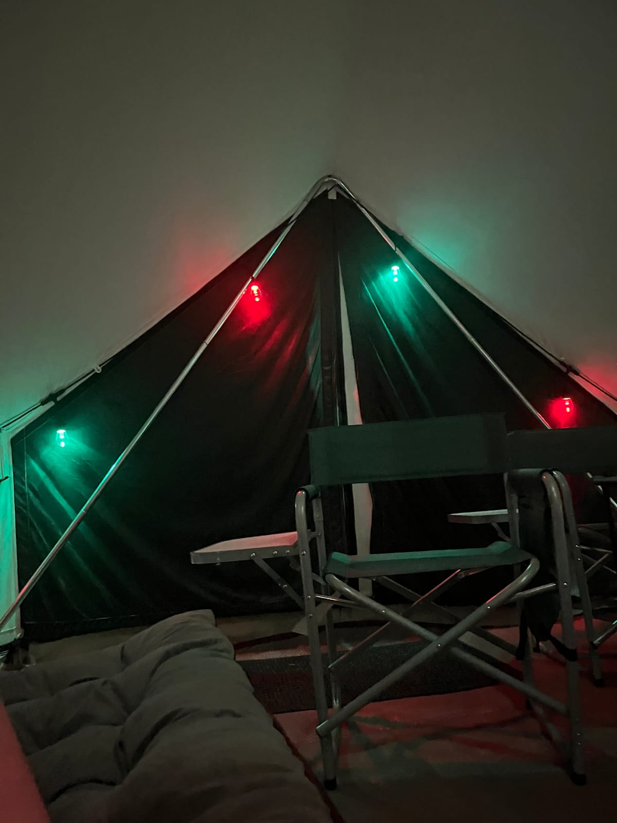 White Duck 20-foot glamping bell tent nestled under pines