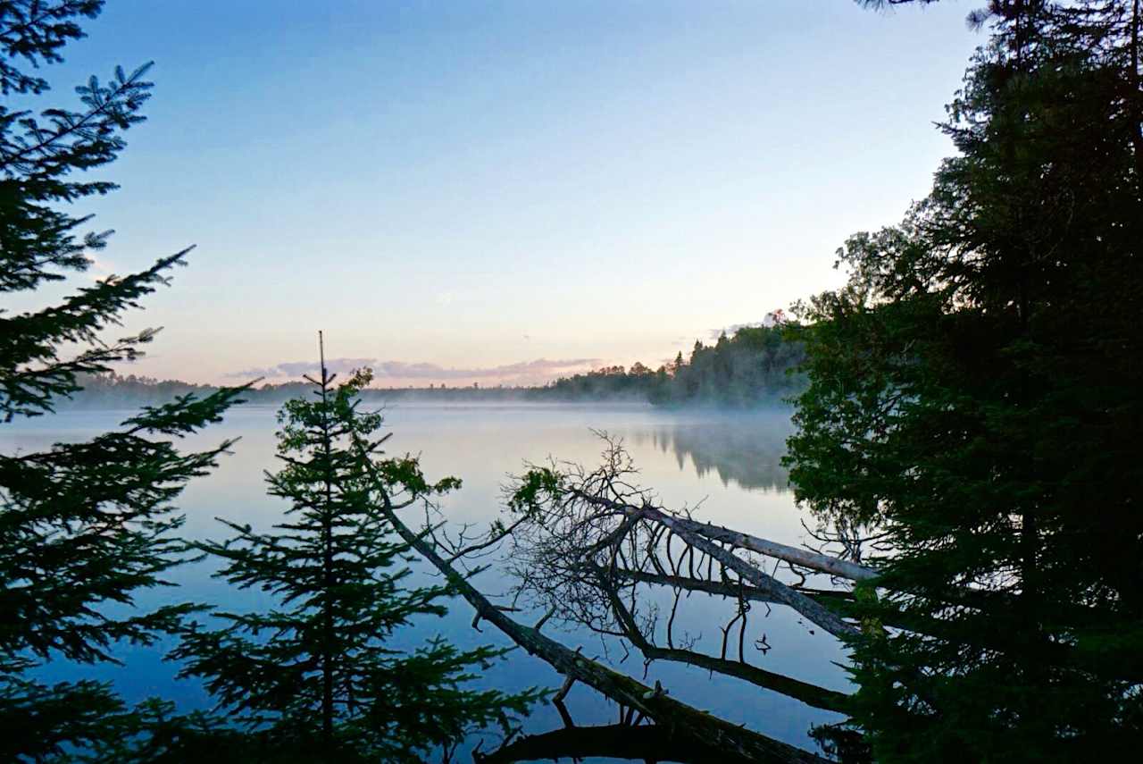 The view from our campsite at the canoe/hike in location. I was able to grab the fog rolling across the lake early in the morning. 