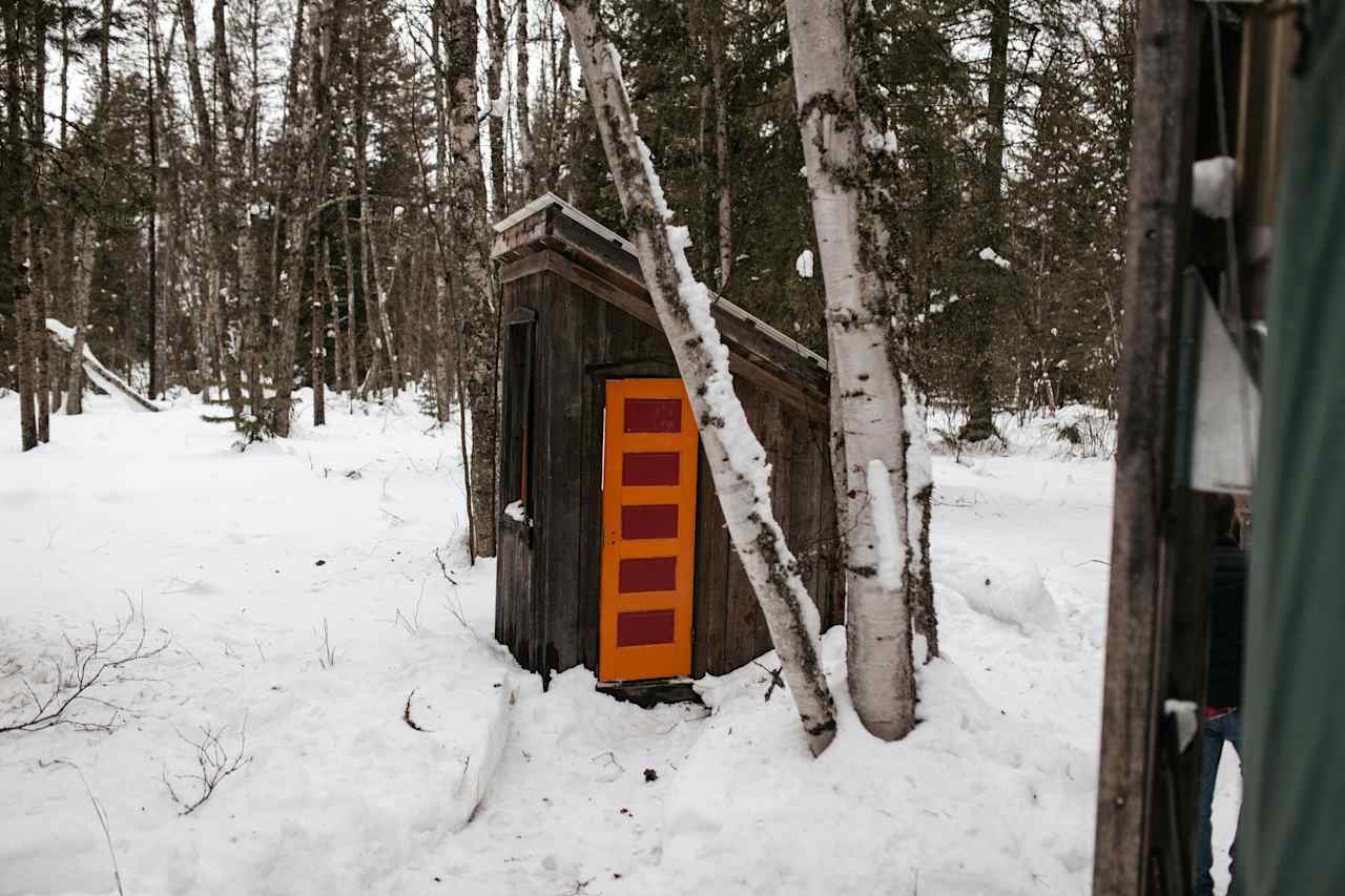 Outside bathroom! It's only a few feet from the yurt, but you do have to walk outside. It's basically a toilet seat on a hole but it works! Not bad at all.