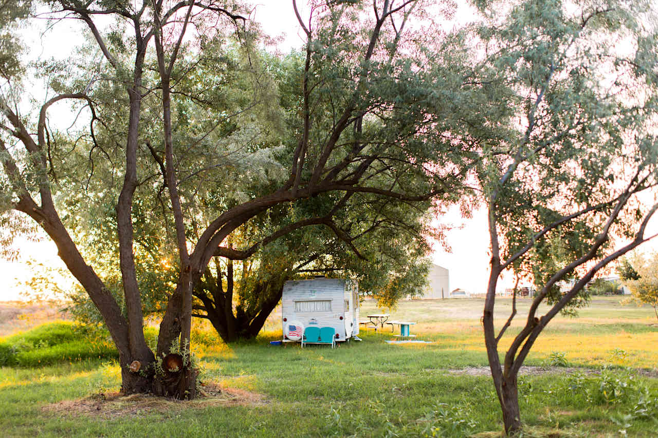 Adorable vintage camper on the property