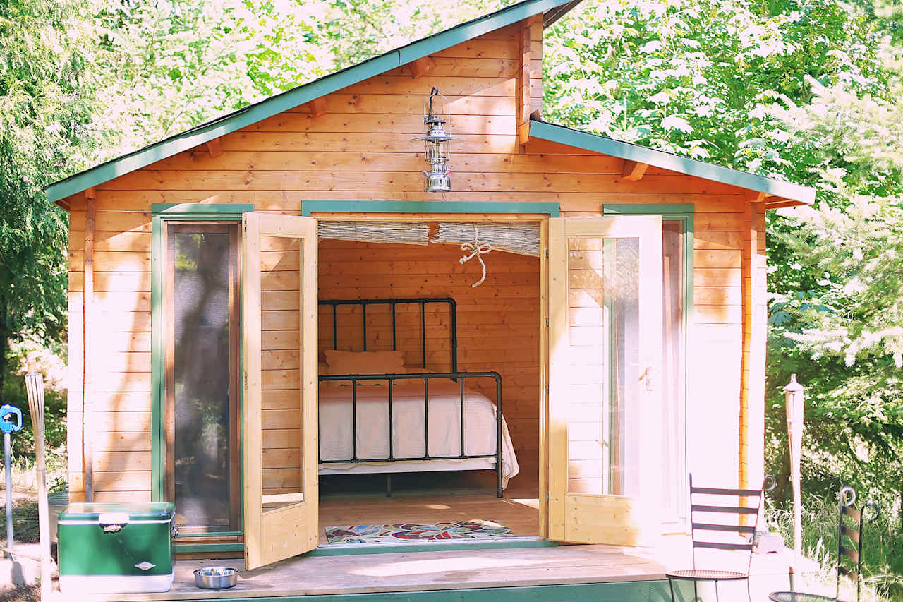 The quaint cabin that rests in 20 acres of beautiful lush property