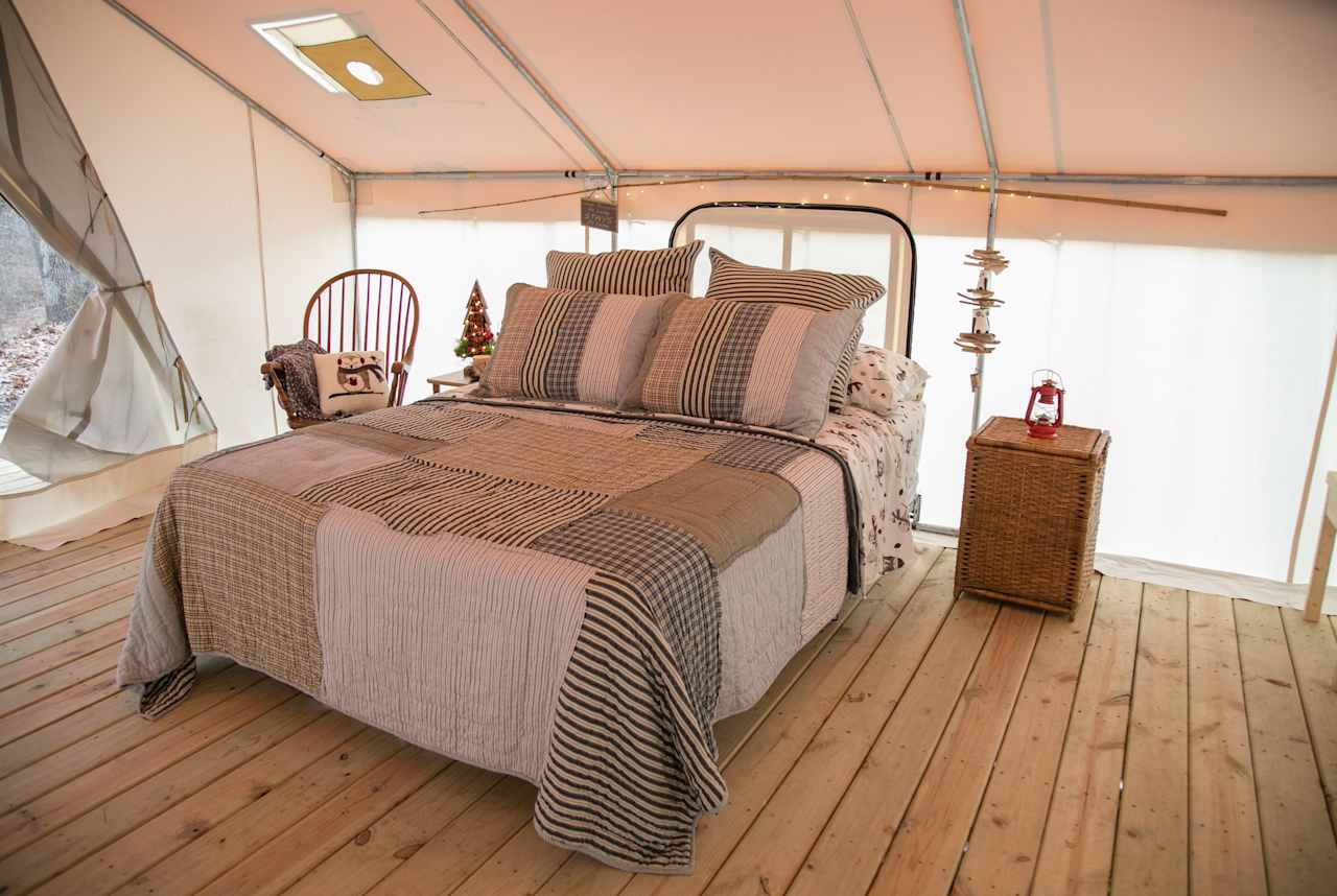 Queen size bed complete with bedding.  Plenty of room for an air mattress if you need more room.  