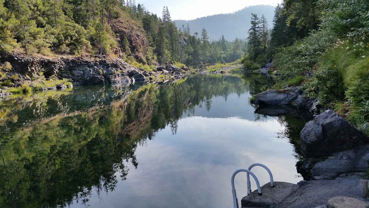 Swimming hole with ladder into the water.