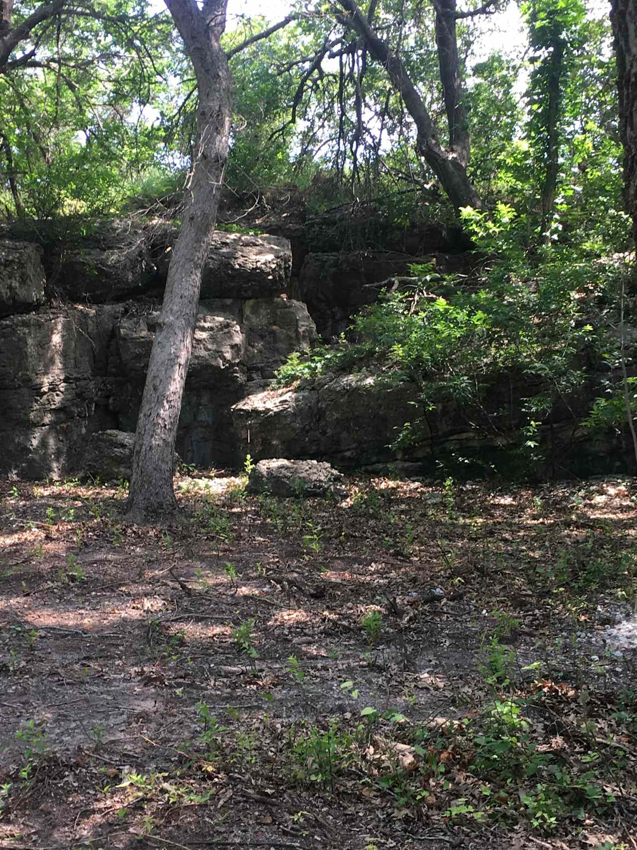 Interesting rock formations abound within the park.  A small cave lies just beyond this gap in the rocks.