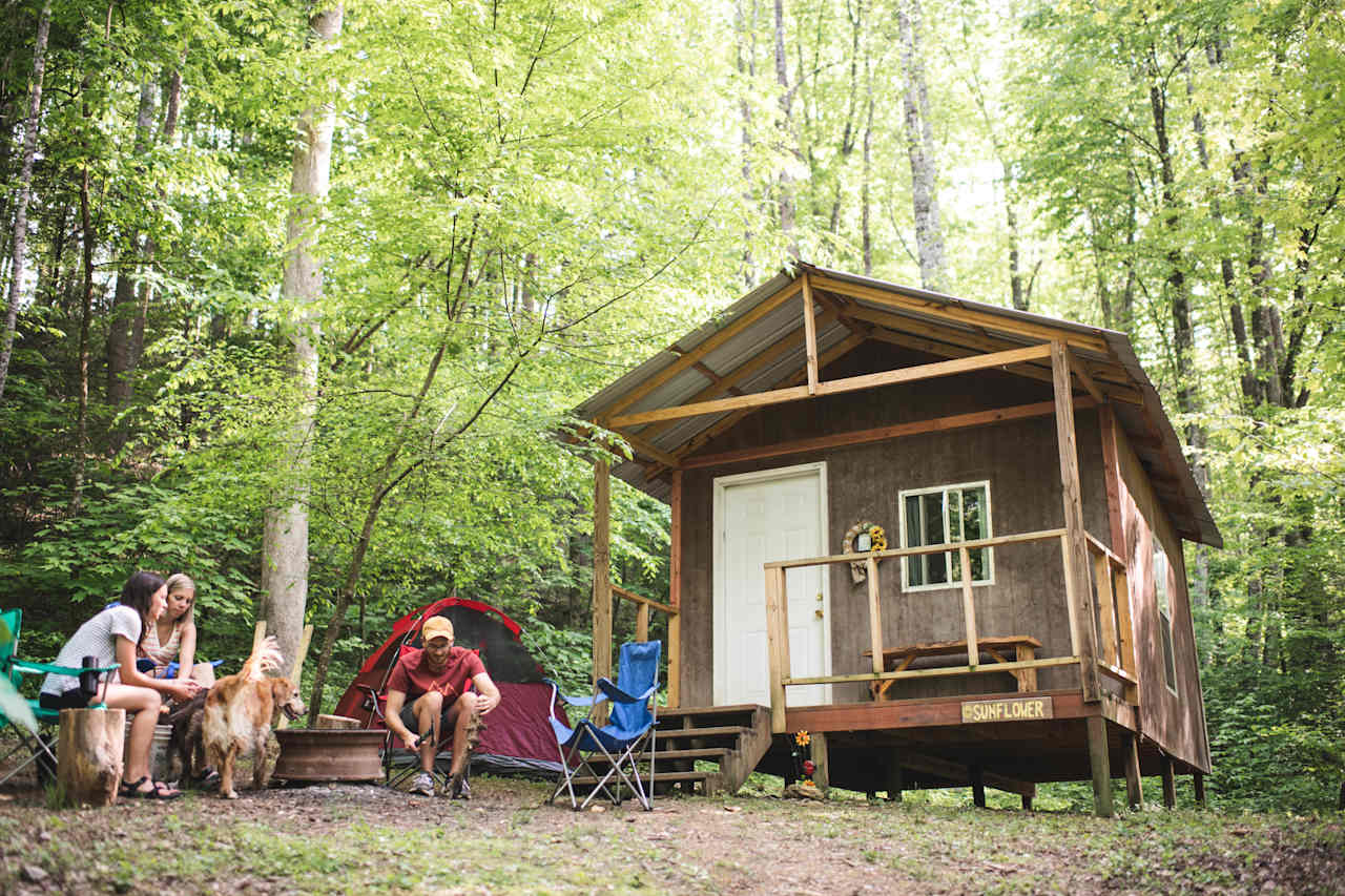 Sunflower cabin is one of 3 precious primitive cabins on the Shoestring Creek Campground property. Each cabin is tucked away in its own little private area off of the road and equipped with a fire pit, charcoal grill, and picnic table.
