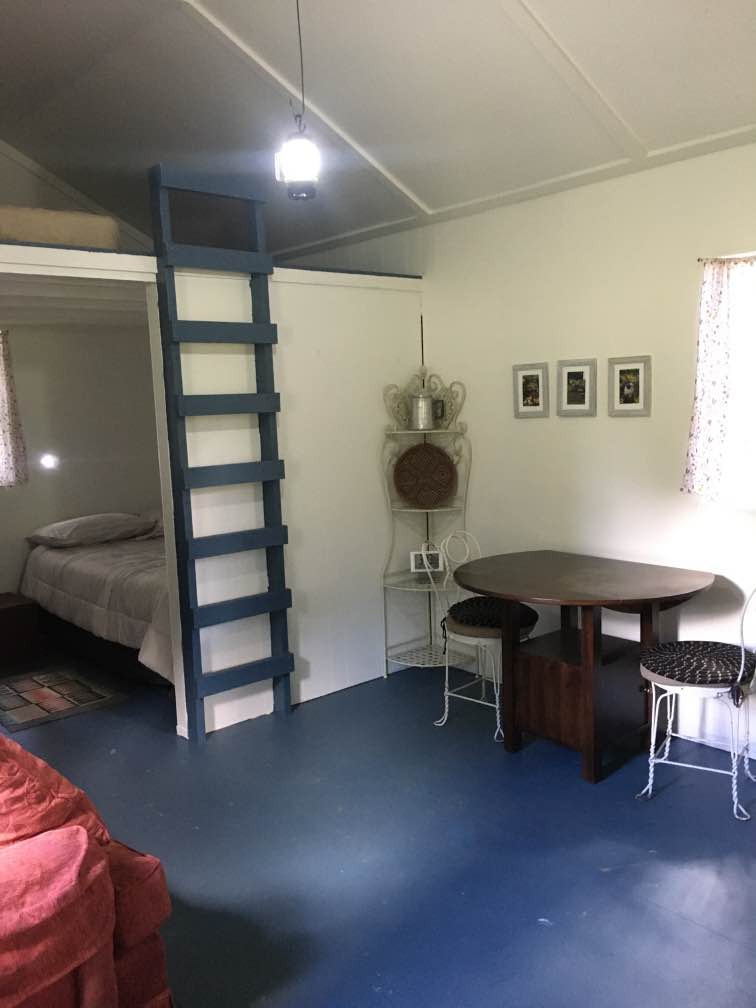The dining table expands to fit 4 comfortably. The cabin doesn't have electricity, but a battery operated lantern and wall-mounted LED lights provide light in the evenings. 