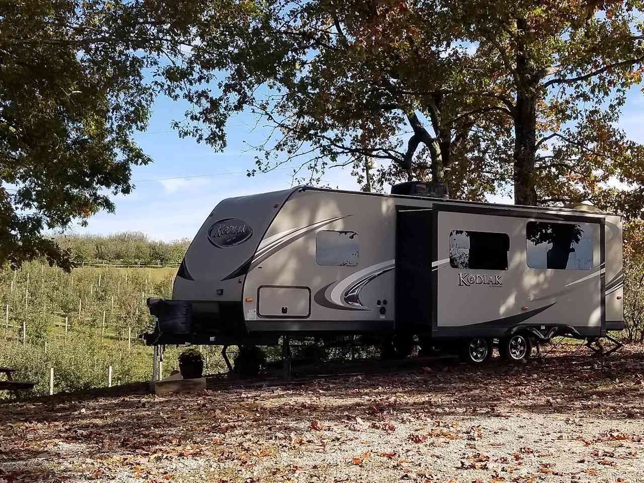 Shaded site nestled under oak trees.