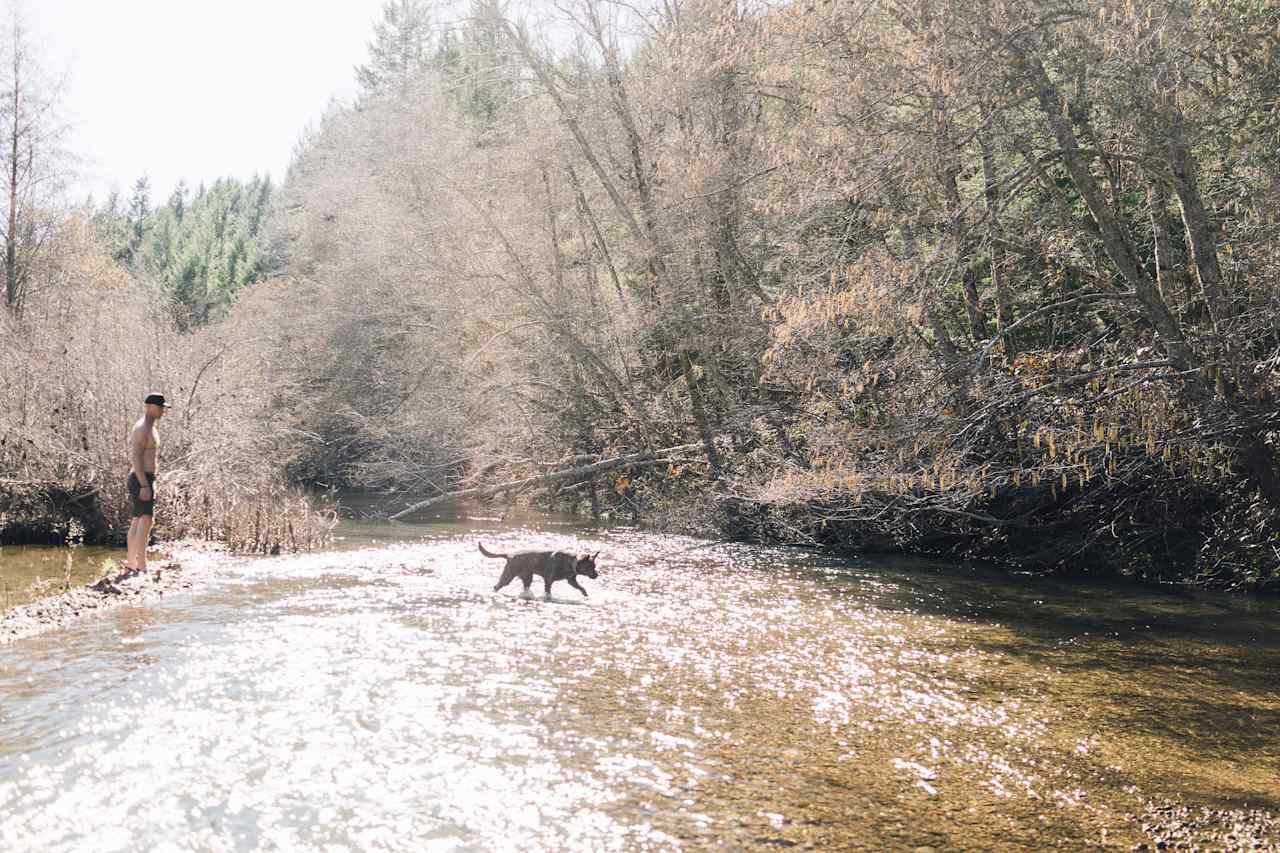 Yui enjoying the creek by the camp