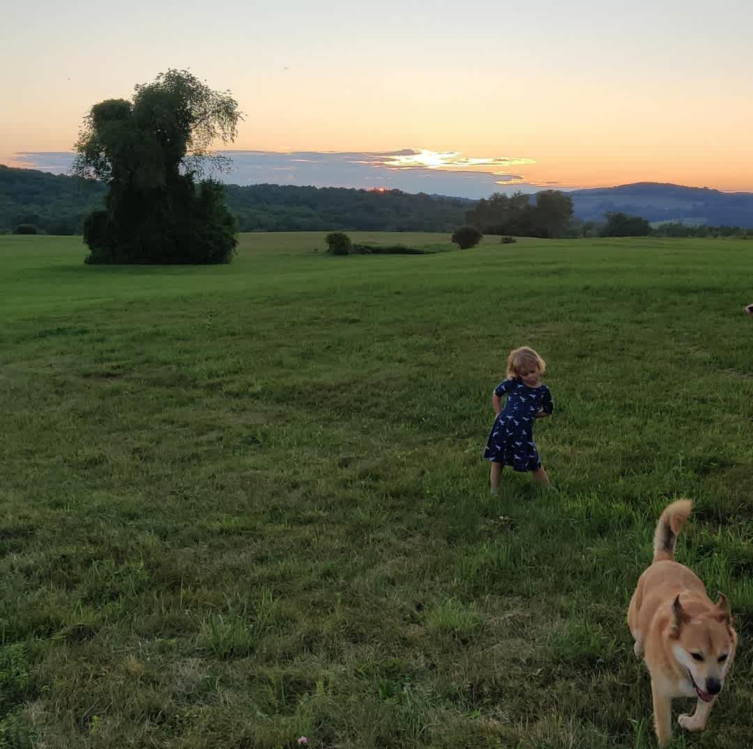 One of our younger campers with Leo, our greeter dog.