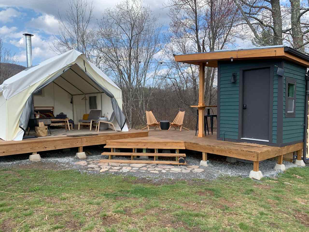 Luxury glampsite with premium safari tent,  wood burning stove, & private, modern full bathhouse 