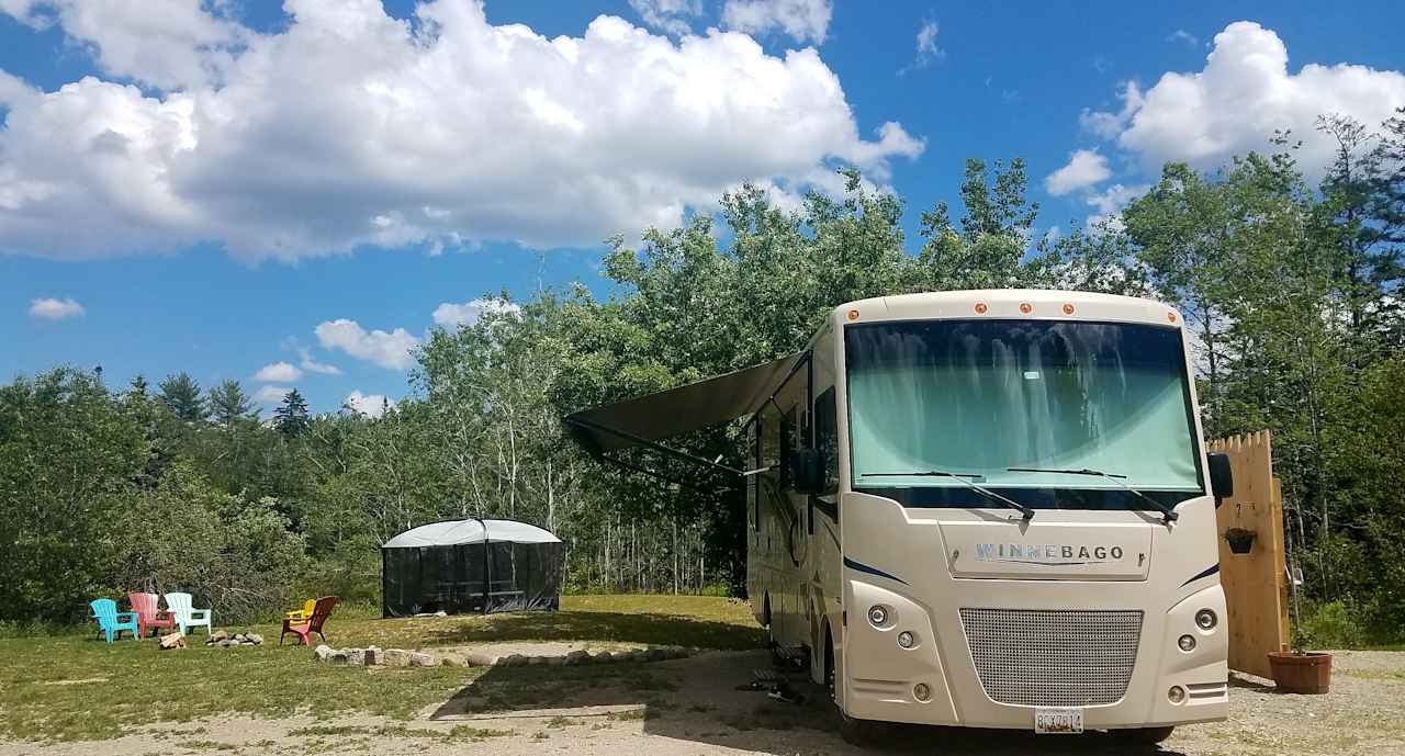 A 40 foot coach on the pad, feel free to bring and set up your own screen house!