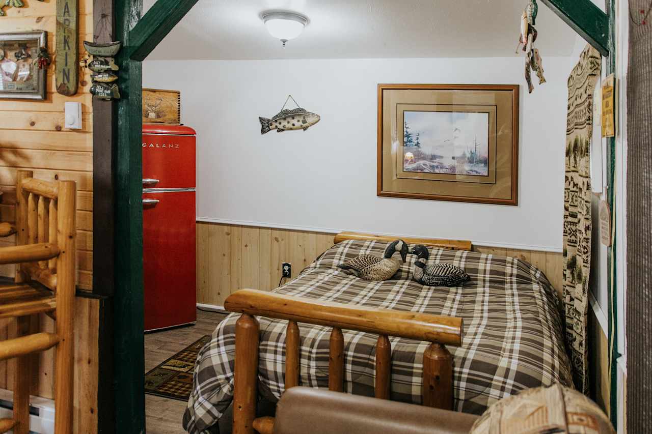 Double sized bed and large refrigerator