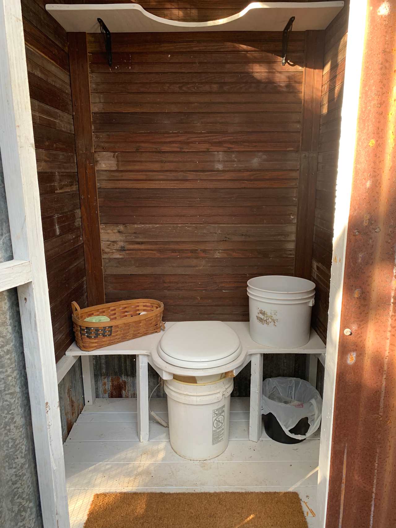 Compostable toilet. Clean and equipped with TP, hand sanitizer, and saw dust. 
