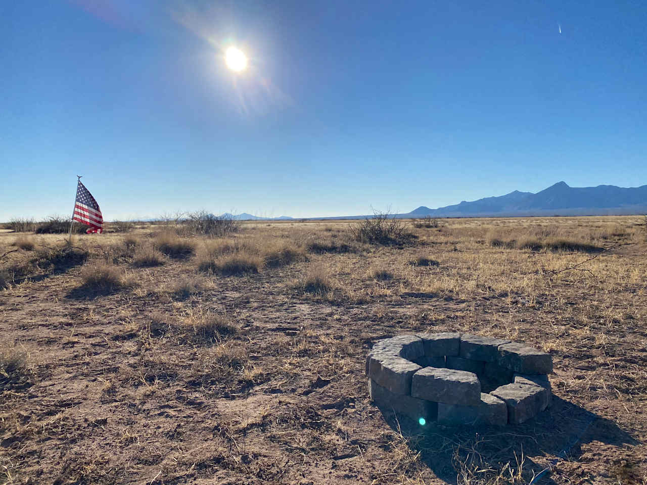 A flag, a fire pit and the Florida mountains in the background!