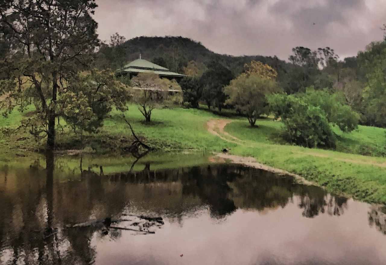 The farm house,  your camp is through another gate in the valley beyond.