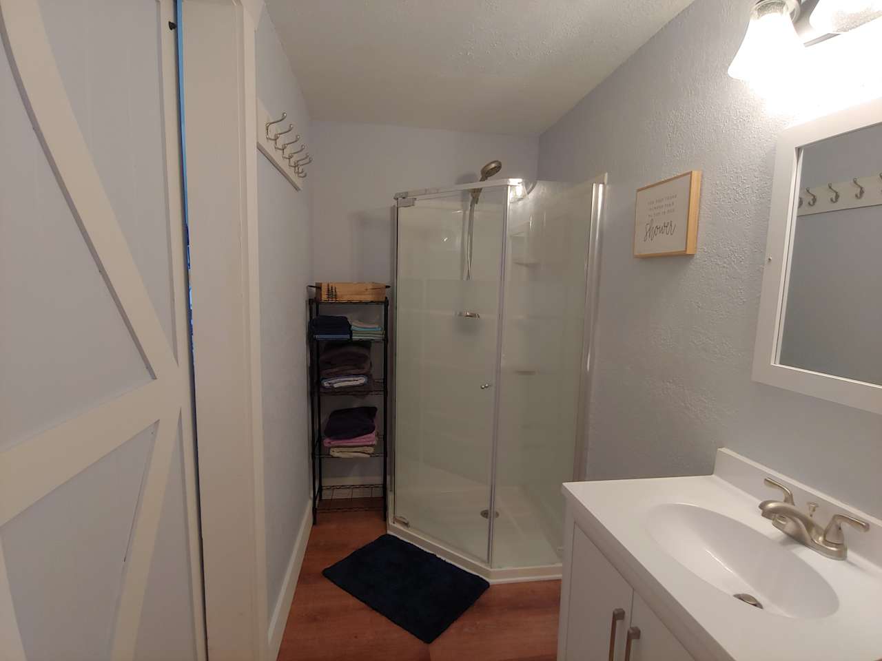 Shower, towels, sink