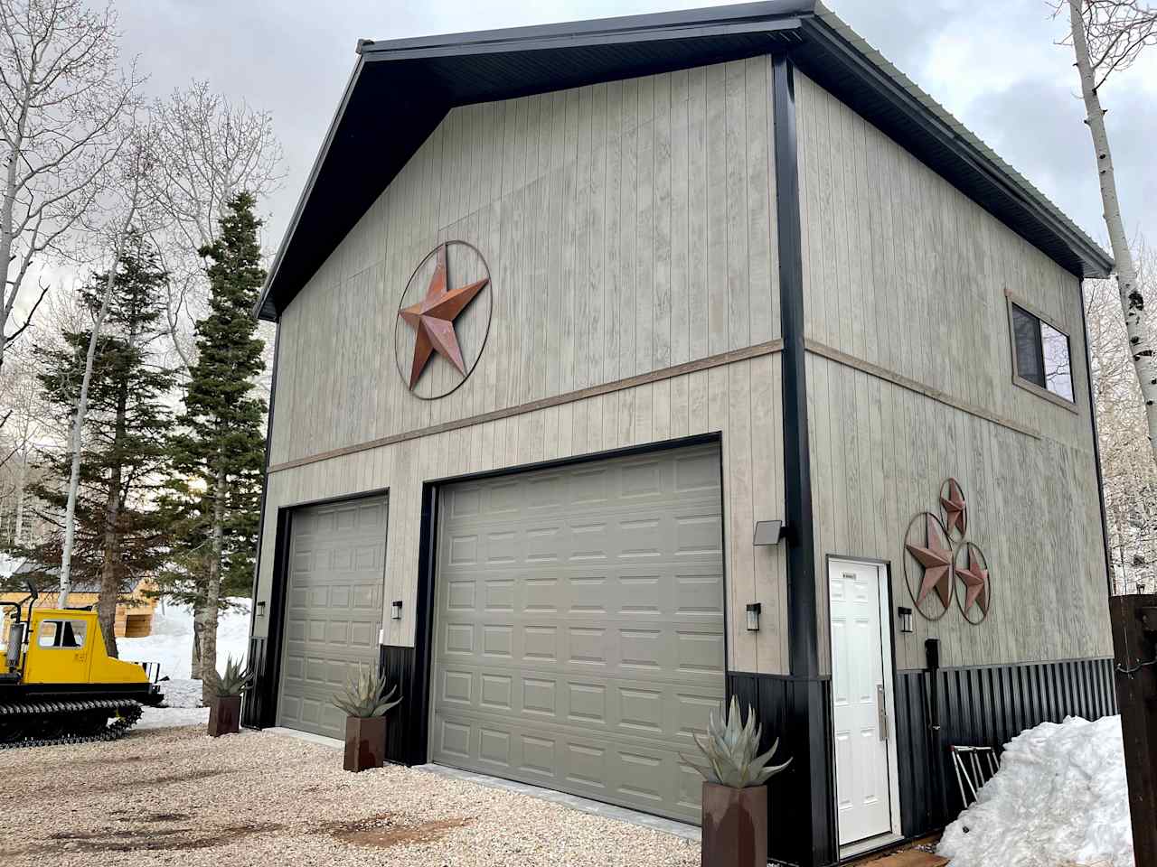 28’ tall pole barn custom built by your hosts Lee & Amber w/Snowcat parked on the side!