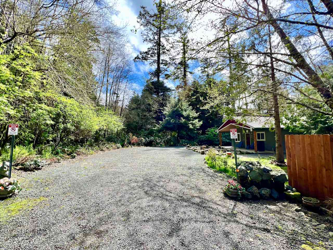 Property at end of dead end street, bordered by forest and hundred year old trees