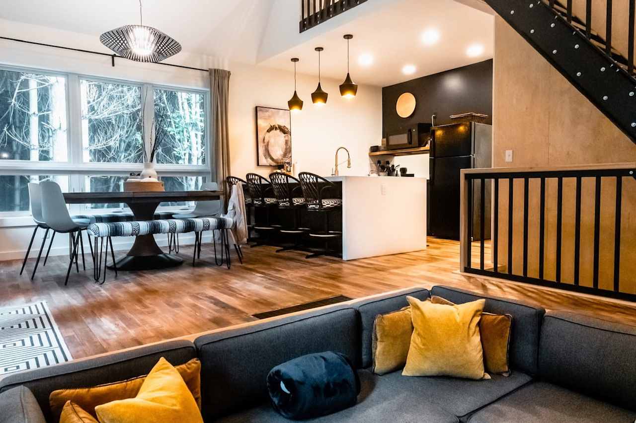 The front of the cabin is open for group meals and socializing, while there are plenty of places to escape for solitude in other areas throughout.