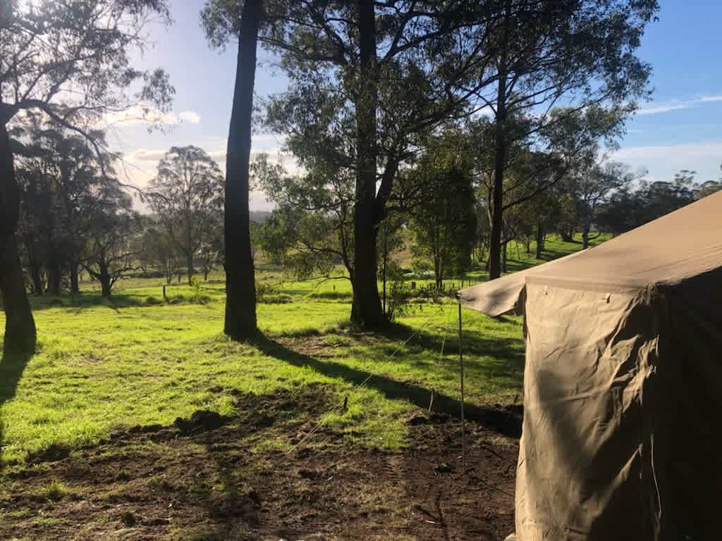 Nested in Mountain overlooking green farm land.