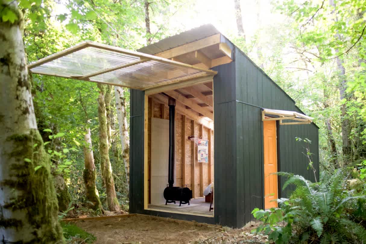 Garage door opens to create a protected patio in rain or sun (Mosquito net in opening).