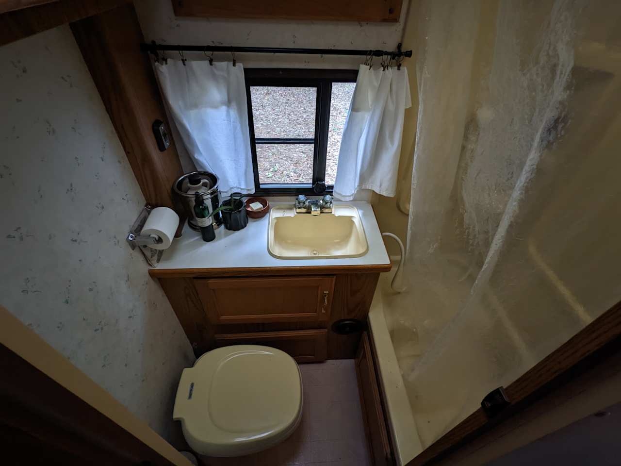 Bathroom with flush toilet, shower, and sink. Extra guests may use the clean composting outhouse located about a 5 minute walk away.