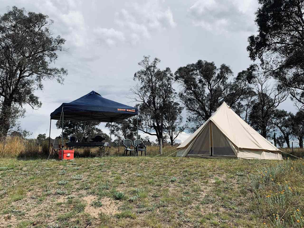 5m canvas bell tent and gazebo shelter with chairs, BBQ, table and 70L esky.
