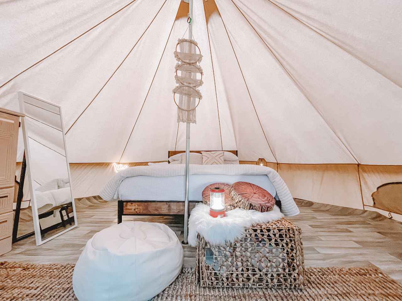 Nice comfy queen size bed with a dresser and floor length mirror.