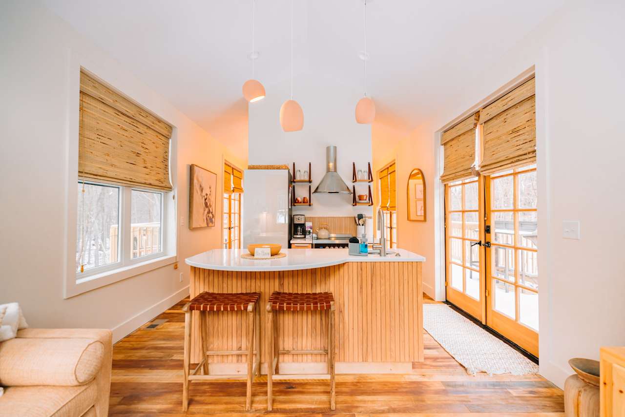 The open, well-designed floor plan and vaulted ceilings make the 450sf cabin live much larger than it's footprint
