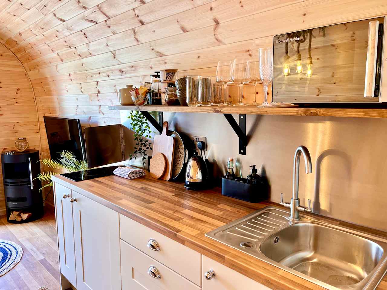 Kitchenette area - induction hob, microwave, fridge, kettle, toaster, tea/coffee 