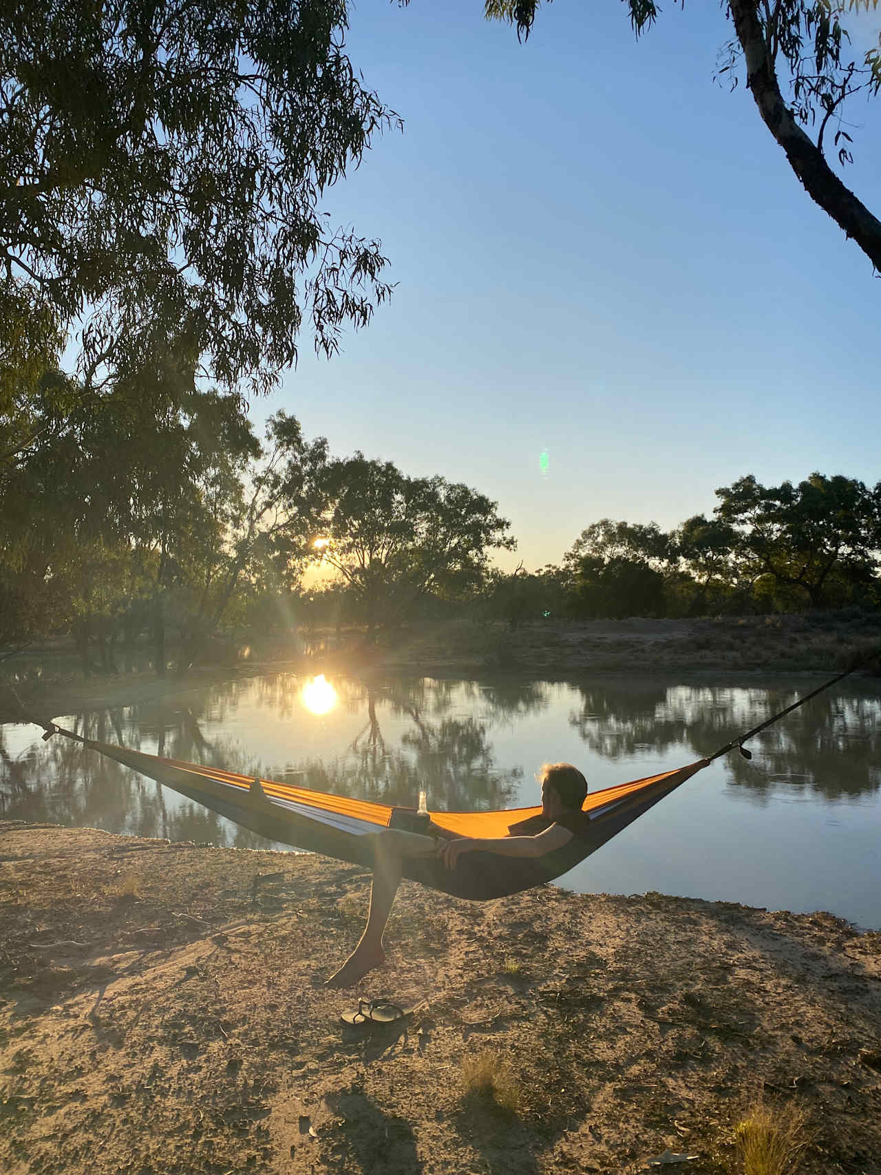 Campers relaxing watching the sunset 