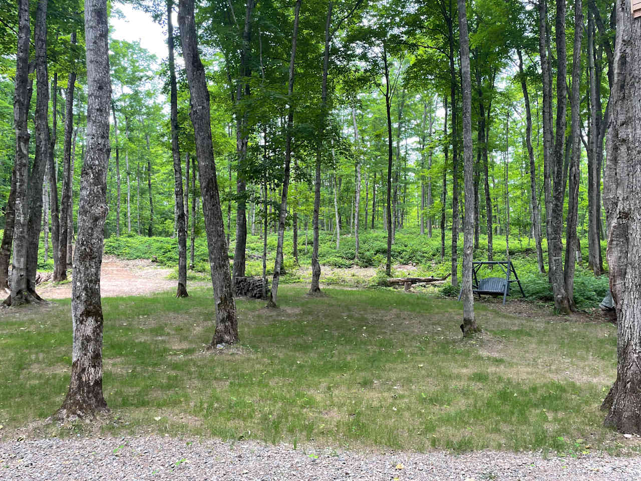 One of multiple tenting areas. To left is gravel area for vans/ campers.