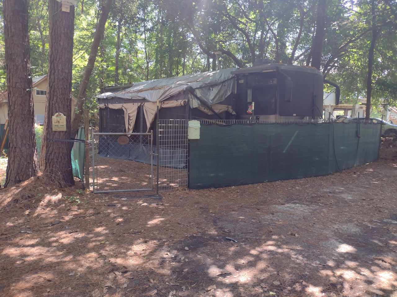 Fenced camper spot + 2 car parking spaces in front of fence 